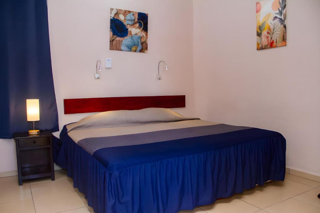 Postel nebo postele na pokoji v ubytování Hotel Cortaza Galería