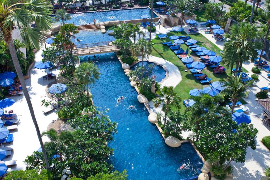 an aerial view of a pool at a resort at Jomtien Palm Beach Hotel and Resort - SHA Extra Plus in Jomtien Beach
