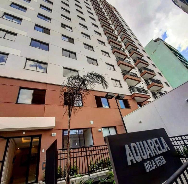 a tall building with a sign in front of it at Bela Vista São Paulo "Apto moderno, confortável e proximo a varios pontos turistico" in Sao Paulo