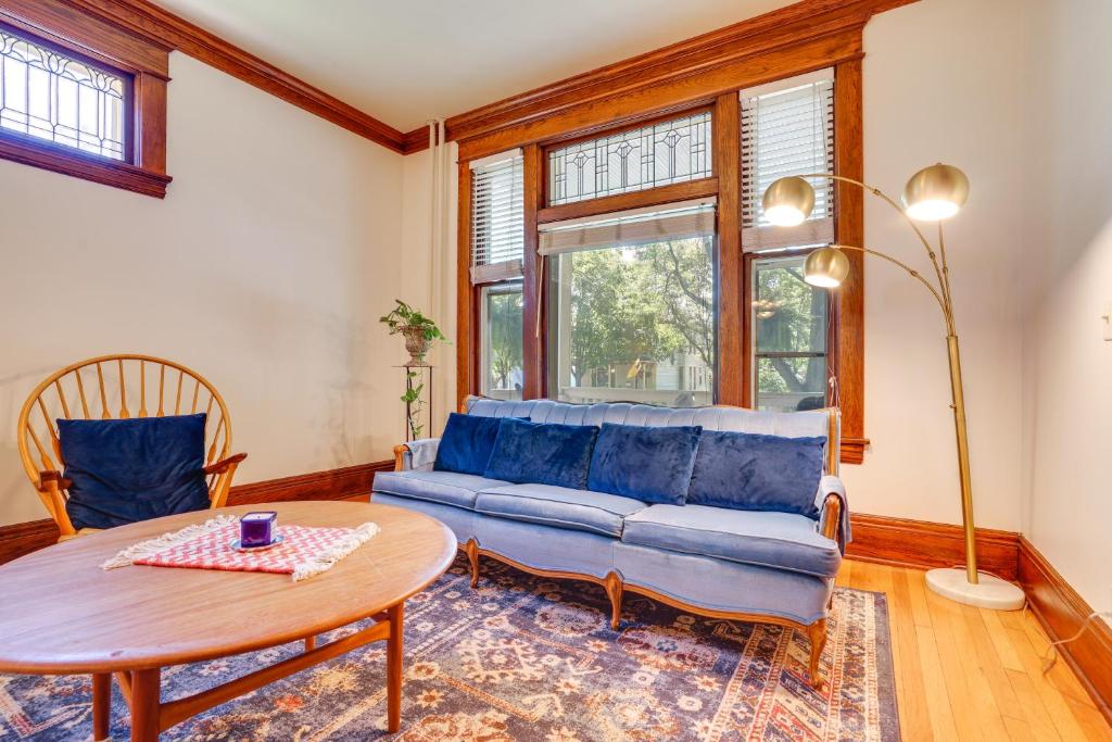 a living room with a couch and a table at Walk to Selby Ave! Historic Cathedral Hill Unit in Saint Paul