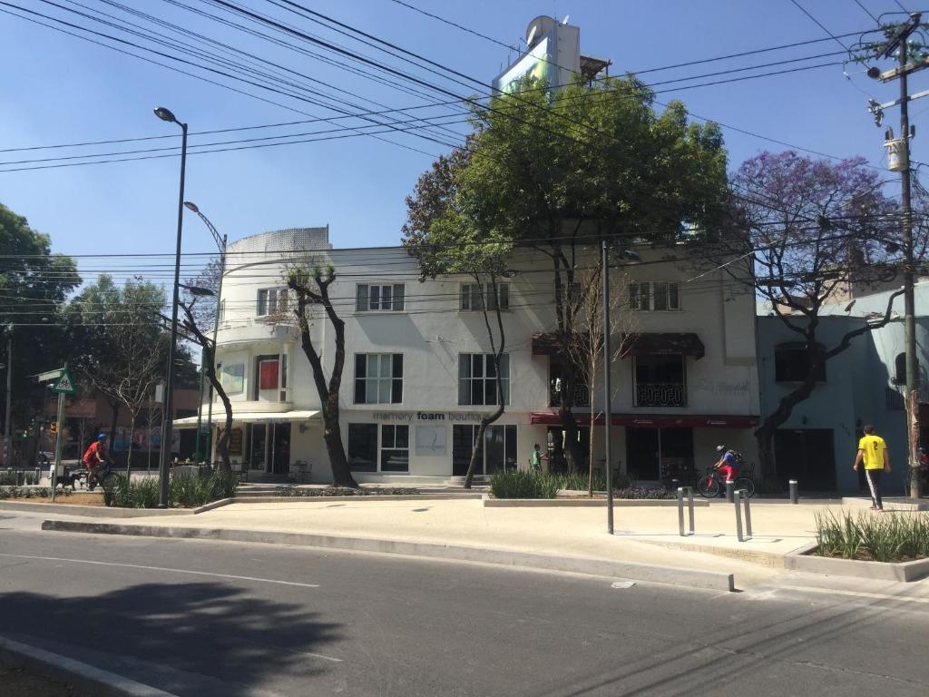 a building on the side of a street at Casa Corp Boutique Suites in Condesa in Mexico City