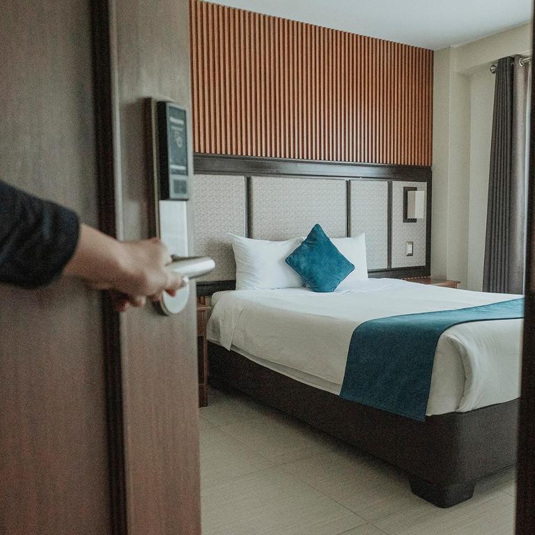 Postel nebo postele na pokoji v ubytování Hotel D'Carlo Class