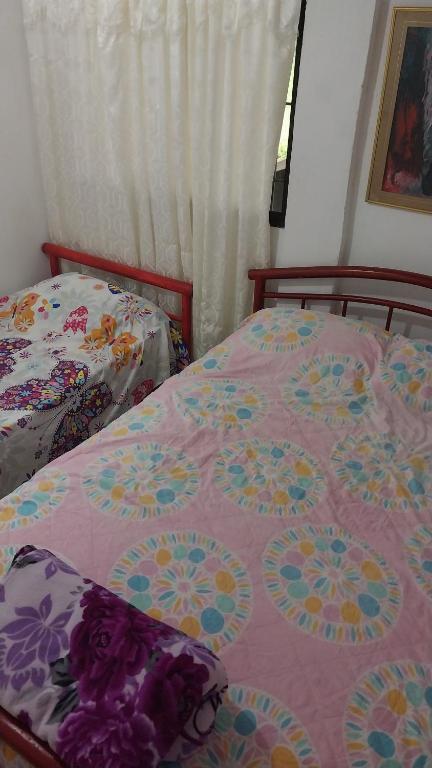 Postel nebo postele na pokoji v ubytování Cabaña Villa Gabi