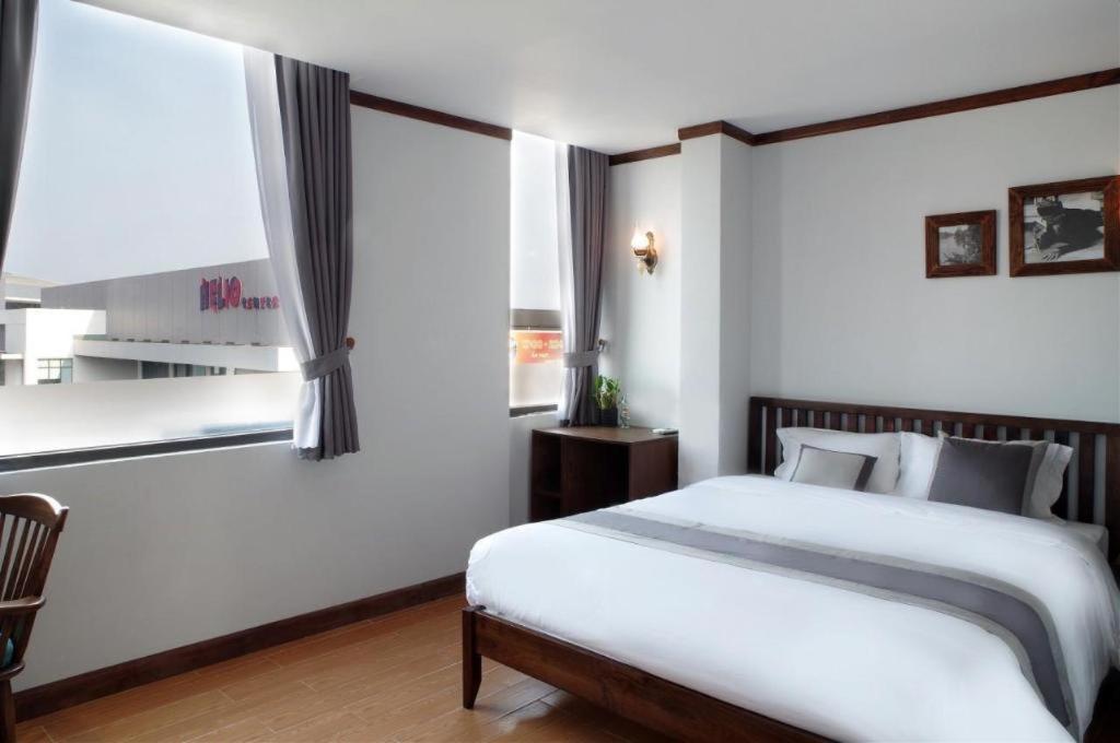 Ένα ή περισσότερα κρεβάτια σε δωμάτιο στο ORIGO HOTEL DANANG