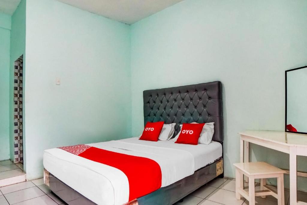 Postel nebo postele na pokoji v ubytování Hotel O Roemah Gh