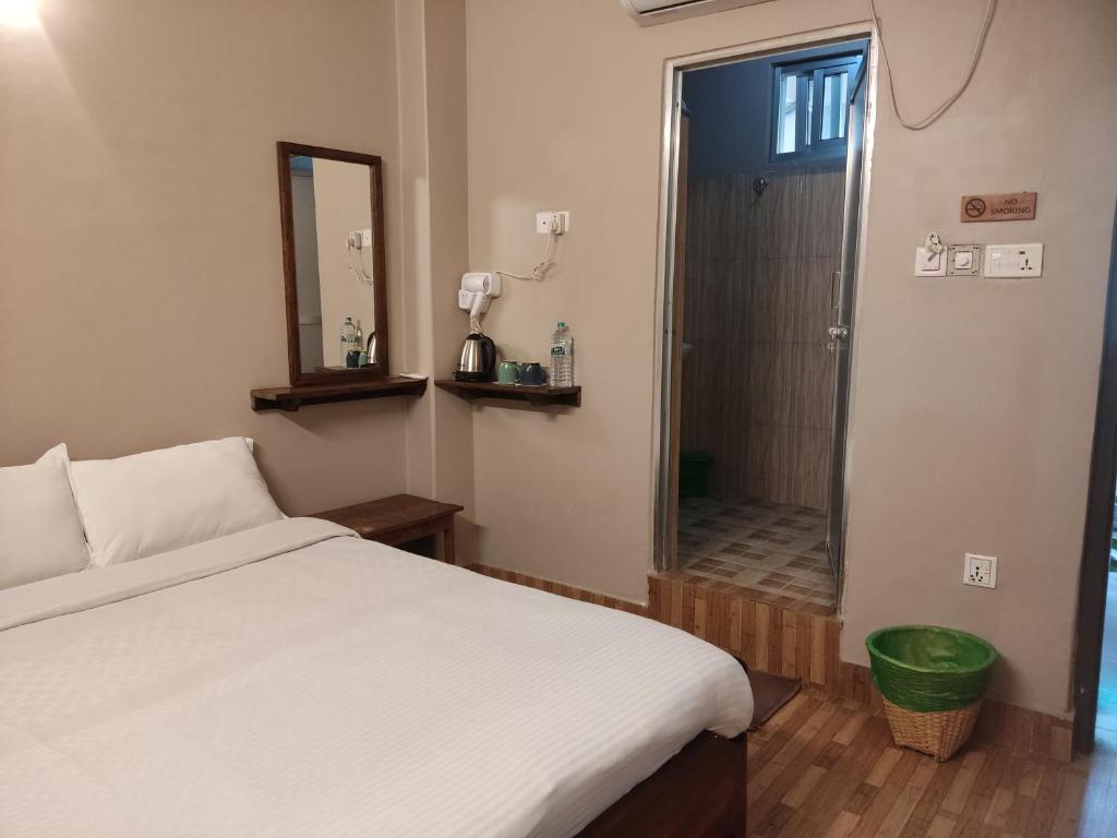 Letto o letti in una camera di Hotel Blossom