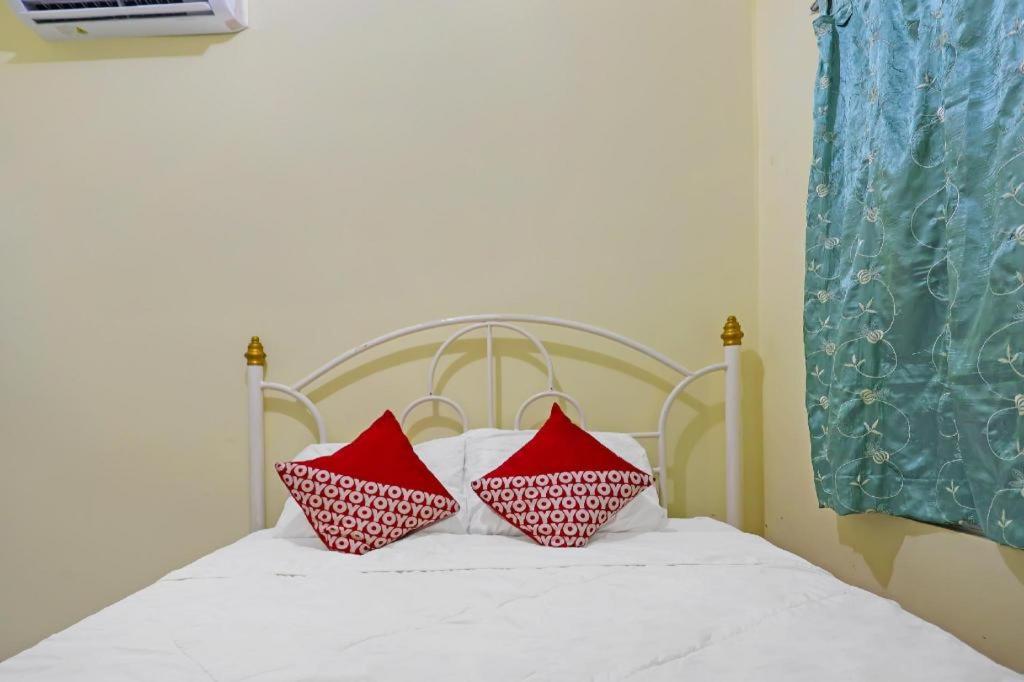 Postel nebo postele na pokoji v ubytování OYO 91974 Alfisal Syariah