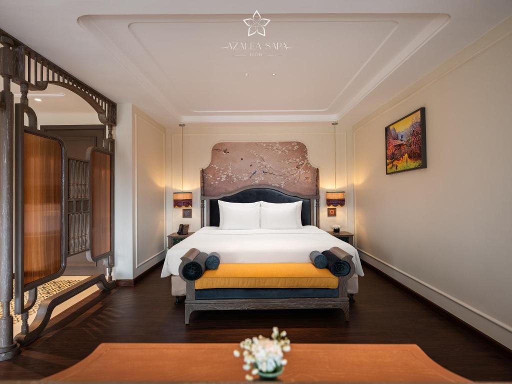Postel nebo postele na pokoji v ubytování Azalea Sapa Hotel