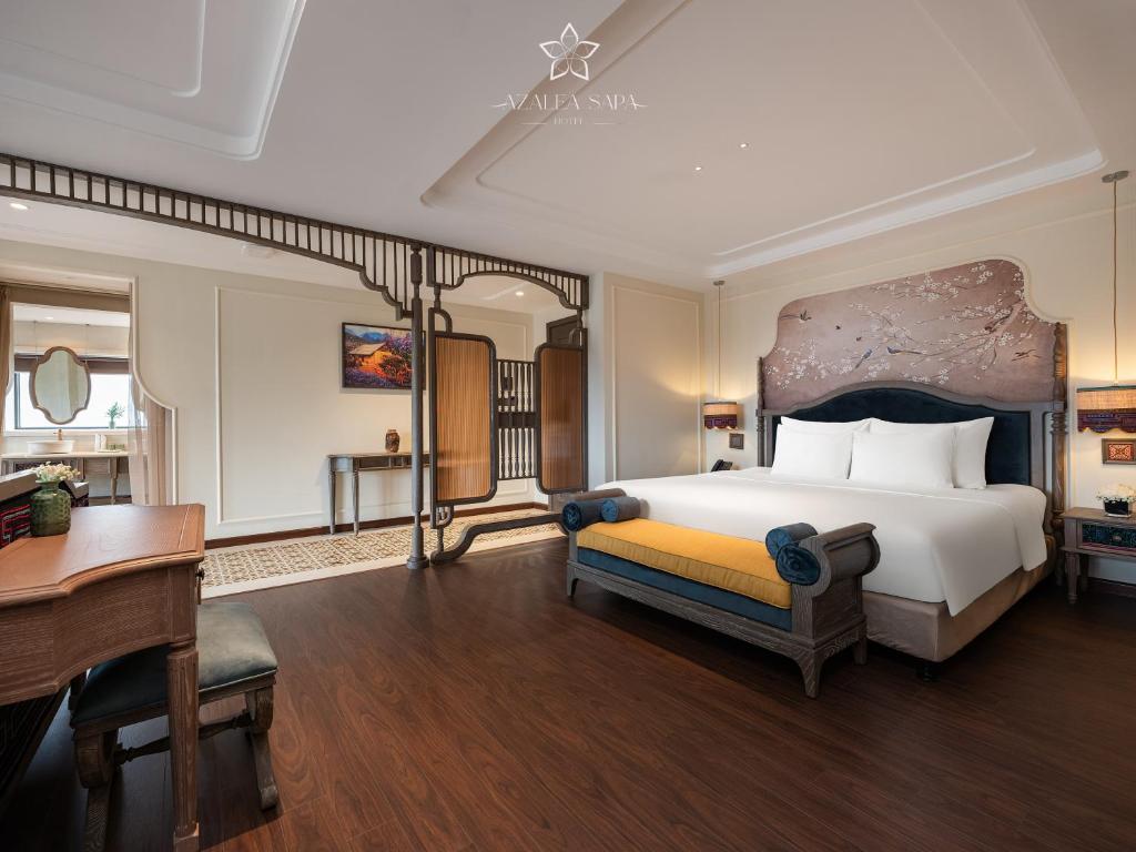 Giường trong phòng chung tại Azalea Sapa Hotel