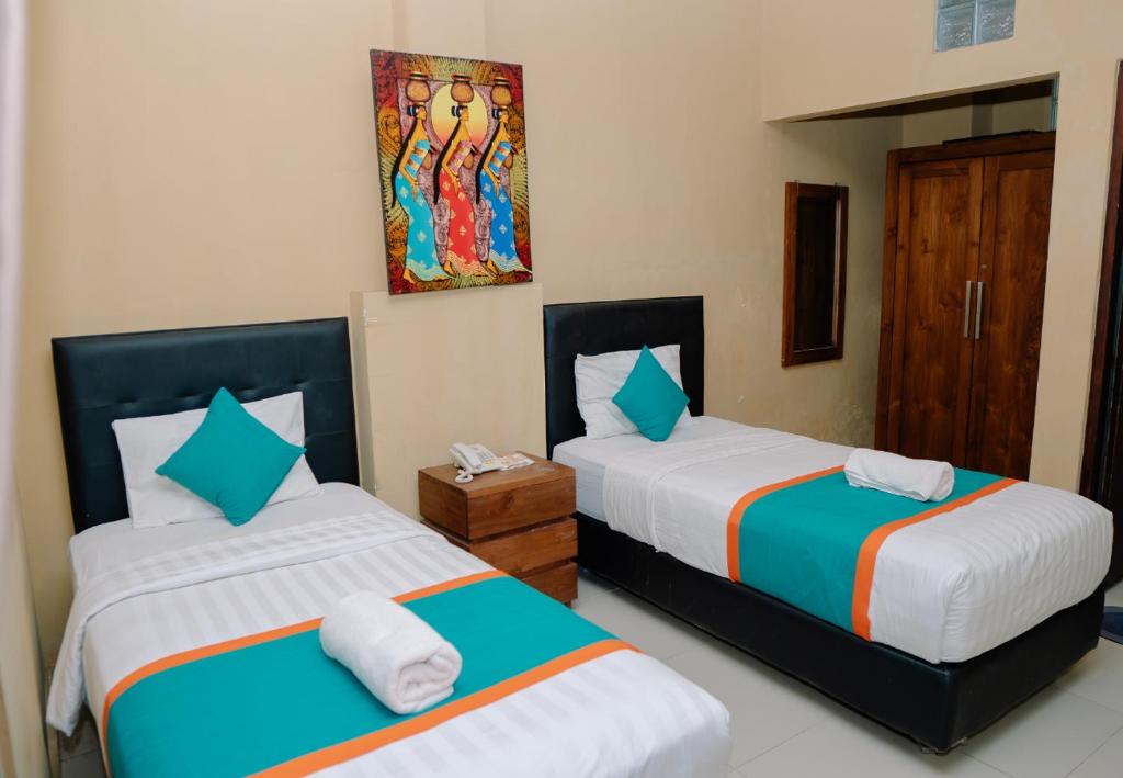 Postel nebo postele na pokoji v ubytování Dante Guesthouse