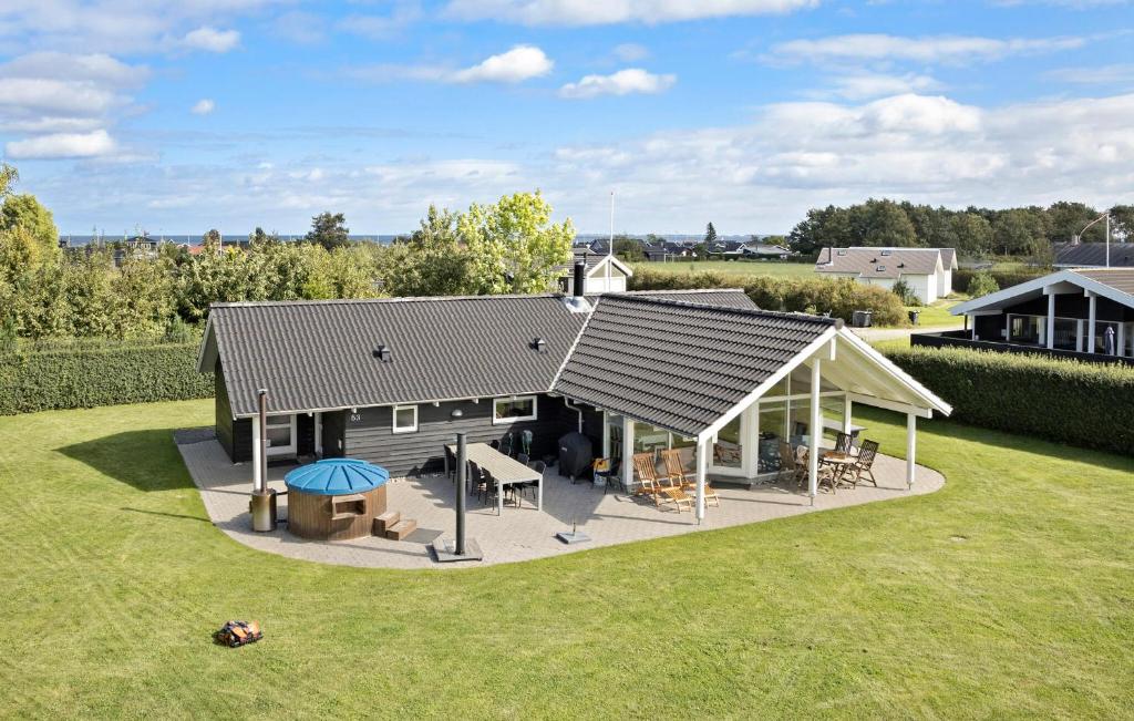 an overhead view of a house with a roof at Holiday Home Thorsvej Otterup V in Hasmark