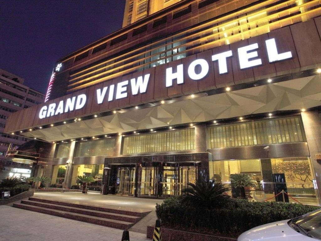 a grandview hotel with a sign on the front of it at Grand View Hotel Tianjin in Tianjin