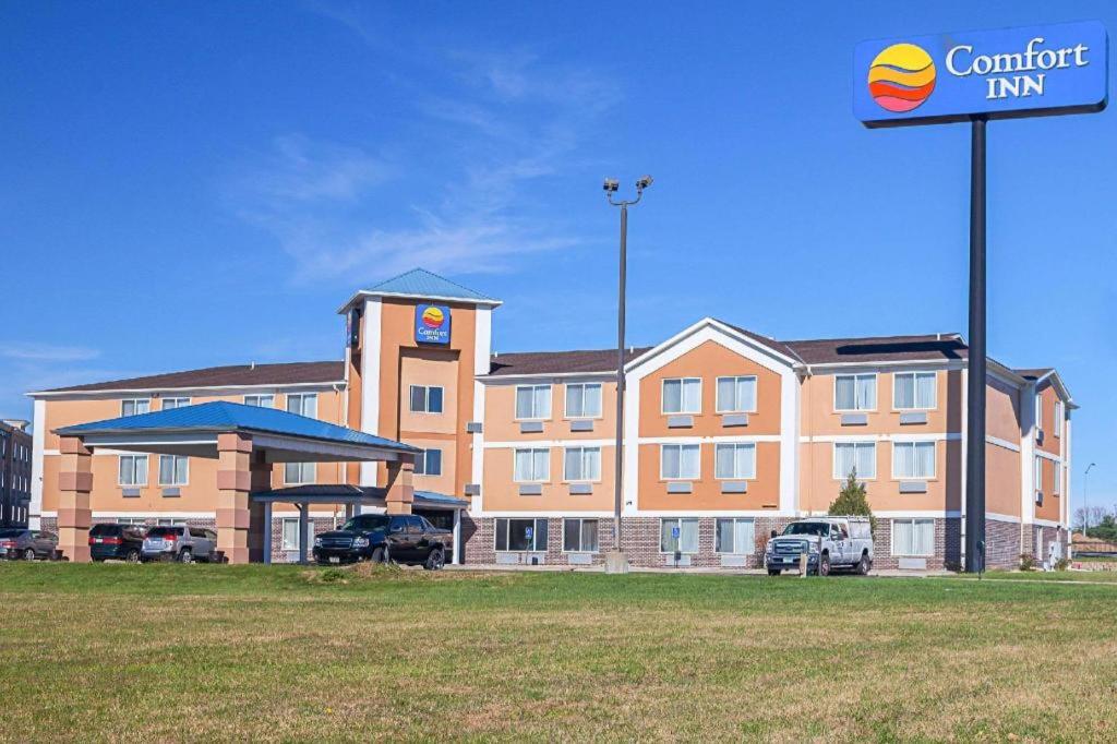 a large building with a sign in front of it at Comfort Inn Lincoln I-80 in Arbor