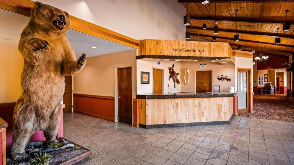 a statue of a bear standing in front of a store at Best Western Lake Lucille Inn in Wasilla