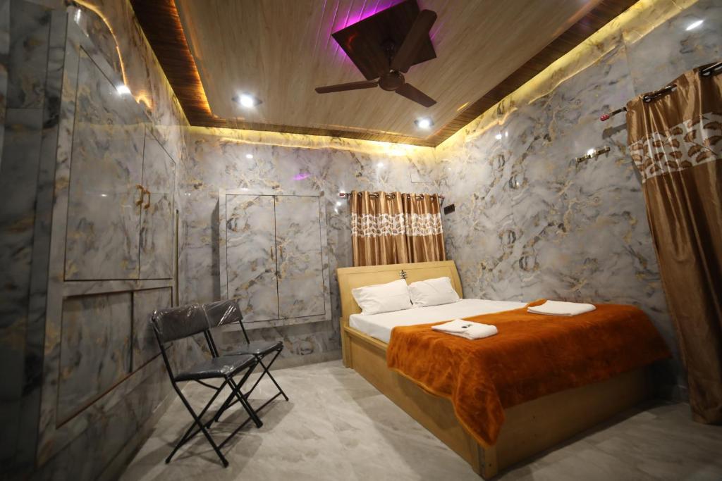 Ένα ή περισσότερα κρεβάτια σε δωμάτιο στο Maa vishalakshi home stay