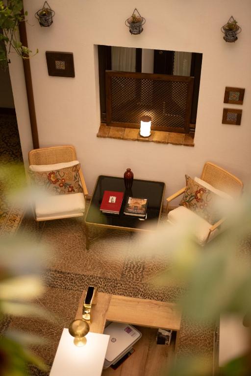 A seating area at HOTEL BOUTIQUE ALMA ANDALUSí
