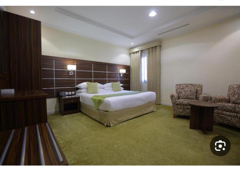 Postel nebo postele na pokoji v ubytování فندق اوتاد المتحدة الماسي awtad elmasi hotel