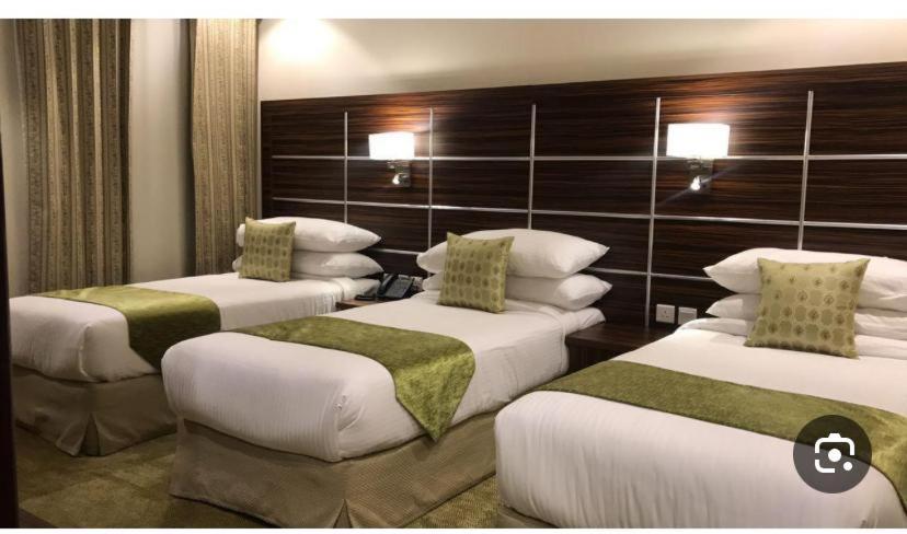 Postel nebo postele na pokoji v ubytování فندق اوتاد المتحدة الماسي awtad elmasi hotel