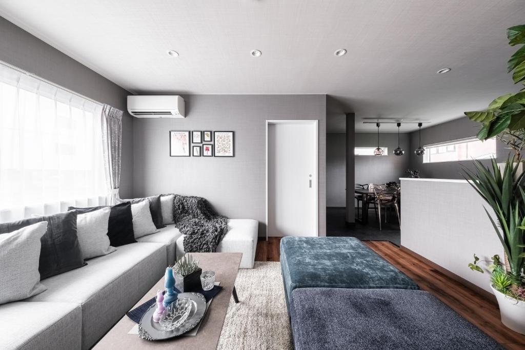 a living room with a couch and a table at The Serenity in Nishi-nijō