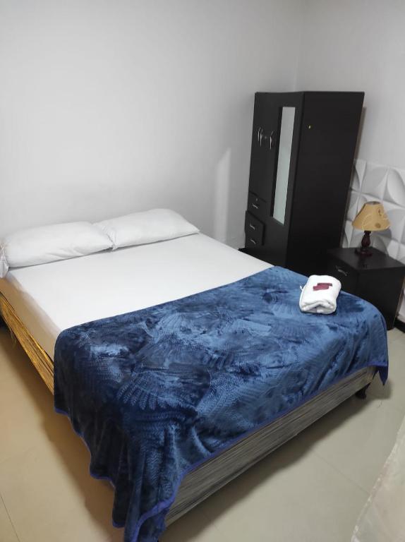 Postel nebo postele na pokoji v ubytování Hotel Bogotá Suites Teusaquillo