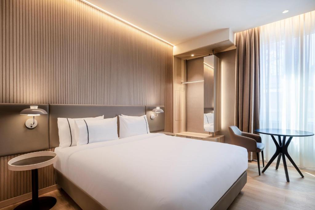 Postel nebo postele na pokoji v ubytování AC Hotel by Marriott Clodio Roma