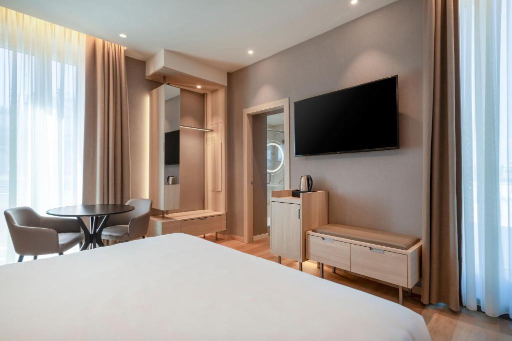 TV a/nebo společenská místnost v ubytování AC Hotel by Marriott Clodio Roma