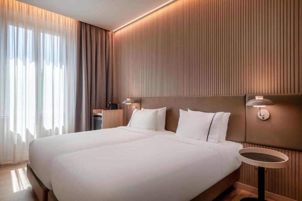 Postel nebo postele na pokoji v ubytování AC Hotel by Marriott Clodio Roma