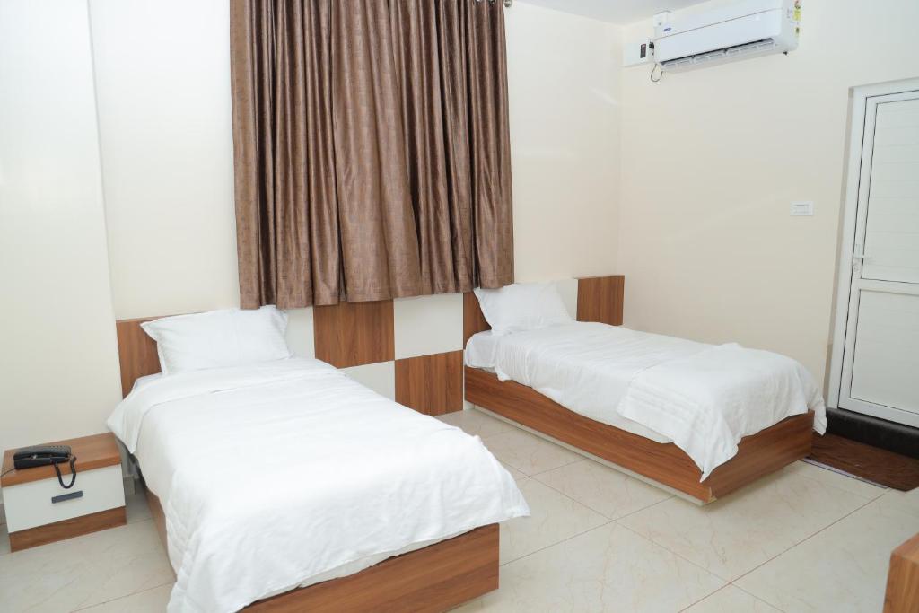 Postel nebo postele na pokoji v ubytování Hotel BR Grand