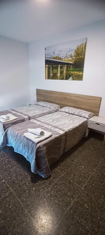 En eller flere senge i et værelse på Villa Olivares