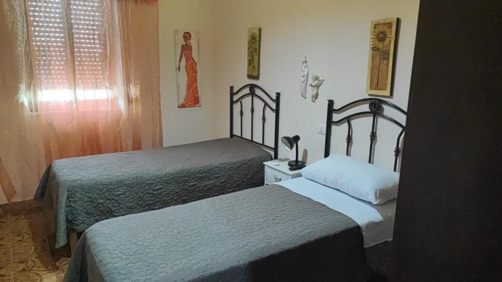 Postel nebo postele na pokoji v ubytování B&B EMPIRA Lamezia Terme