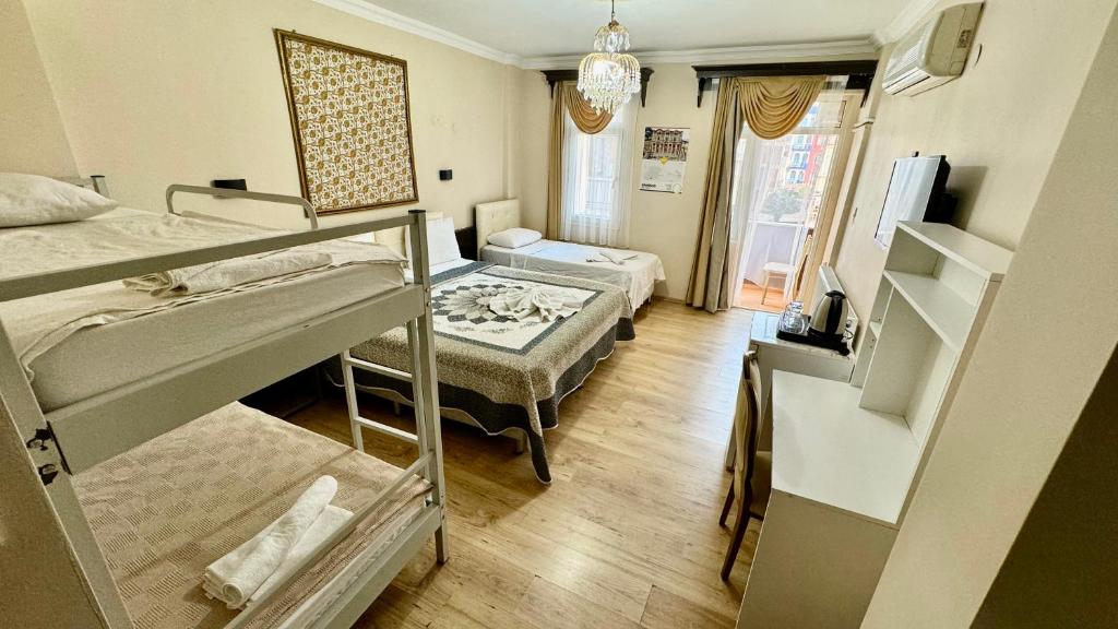 a room with two bunk beds and a living room at EPHESUS CENTRUM in Selcuk