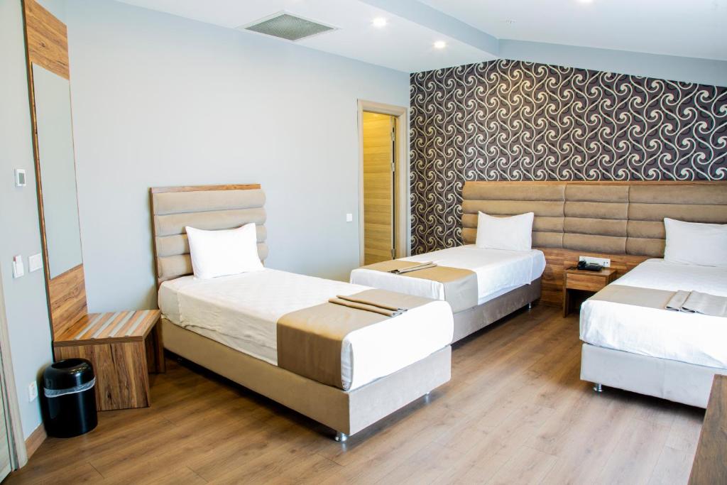 Postel nebo postele na pokoji v ubytování King City Hotel Istanbul Ataturk Airport