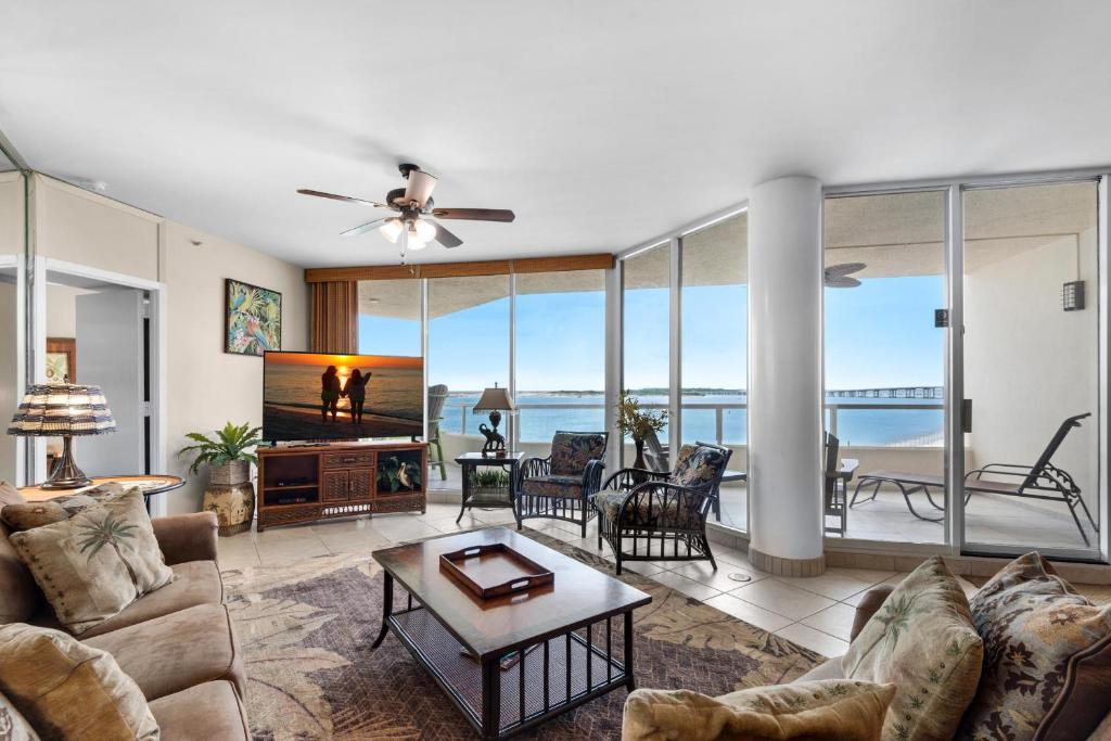 a living room with a couch and a television at East Pass 308 in Destin
