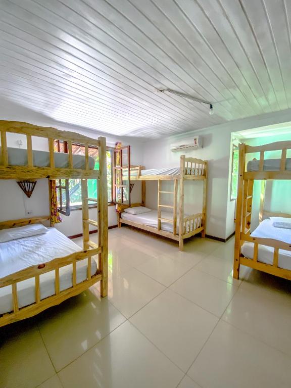Postel nebo postele na pokoji v ubytování Ôxe Uai Hostel