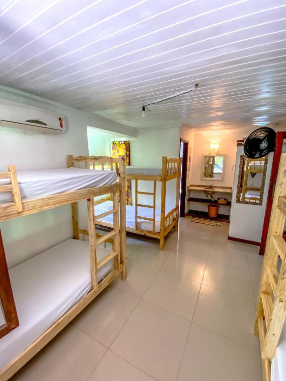 Postel nebo postele na pokoji v ubytování Ôxe Uai Hostel
