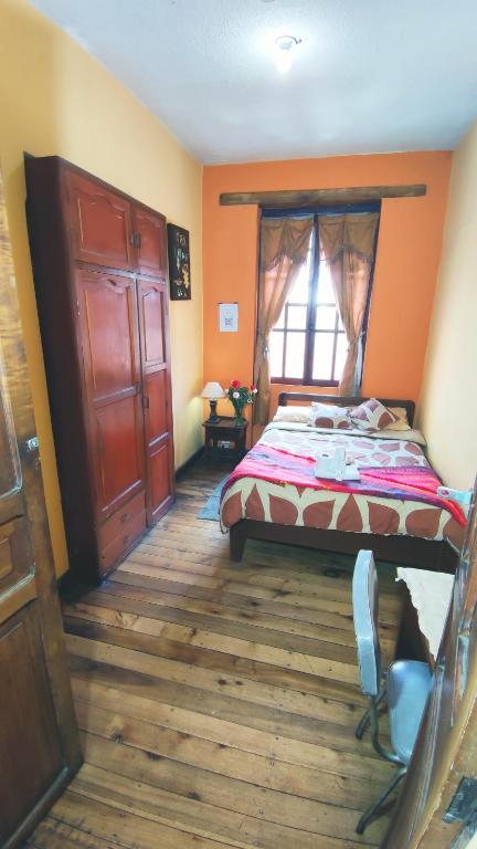 Postel nebo postele na pokoji v ubytování La Posada Colonial