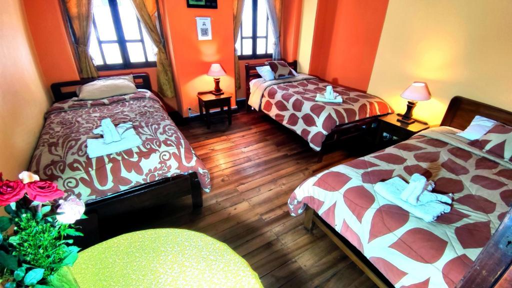 Postel nebo postele na pokoji v ubytování La Posada Colonial