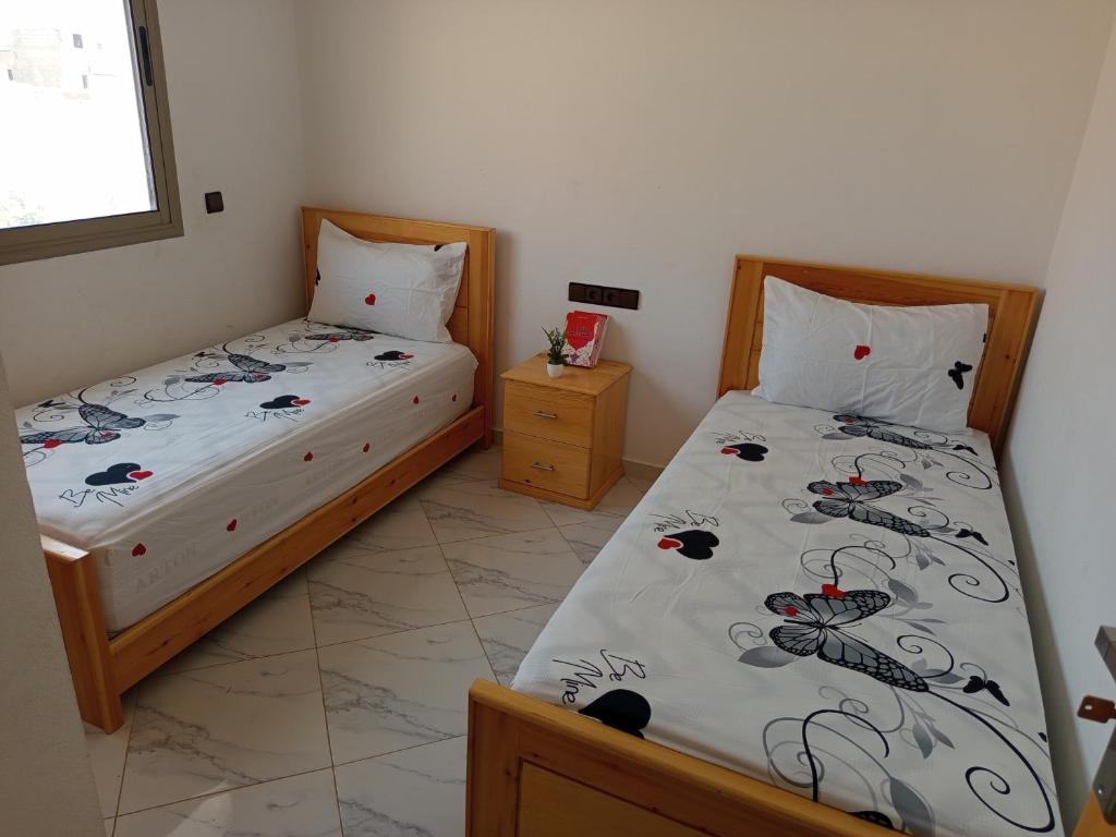 Postel nebo postele na pokoji v ubytování Appartement Hajar