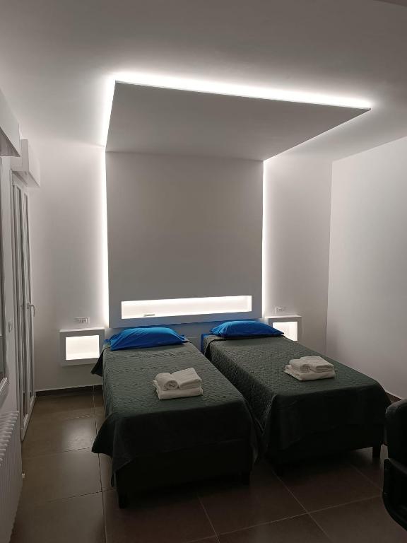 Postel nebo postele na pokoji v ubytování CIVICO 14 Holiday Rooms