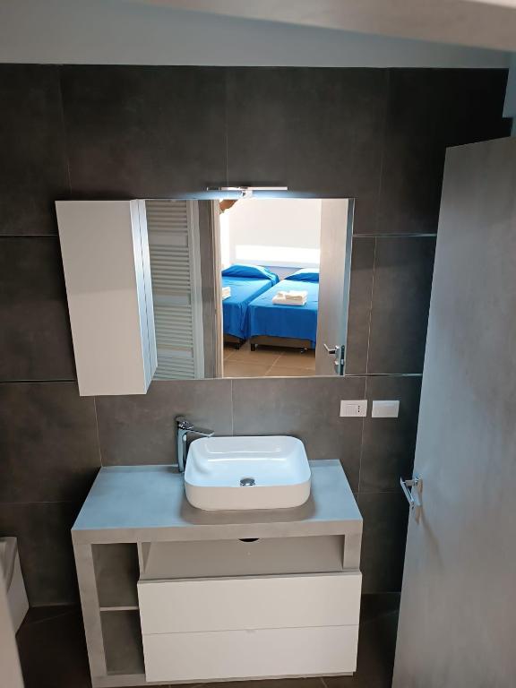 Postel nebo postele na pokoji v ubytování CIVICO 14 Holiday Rooms
