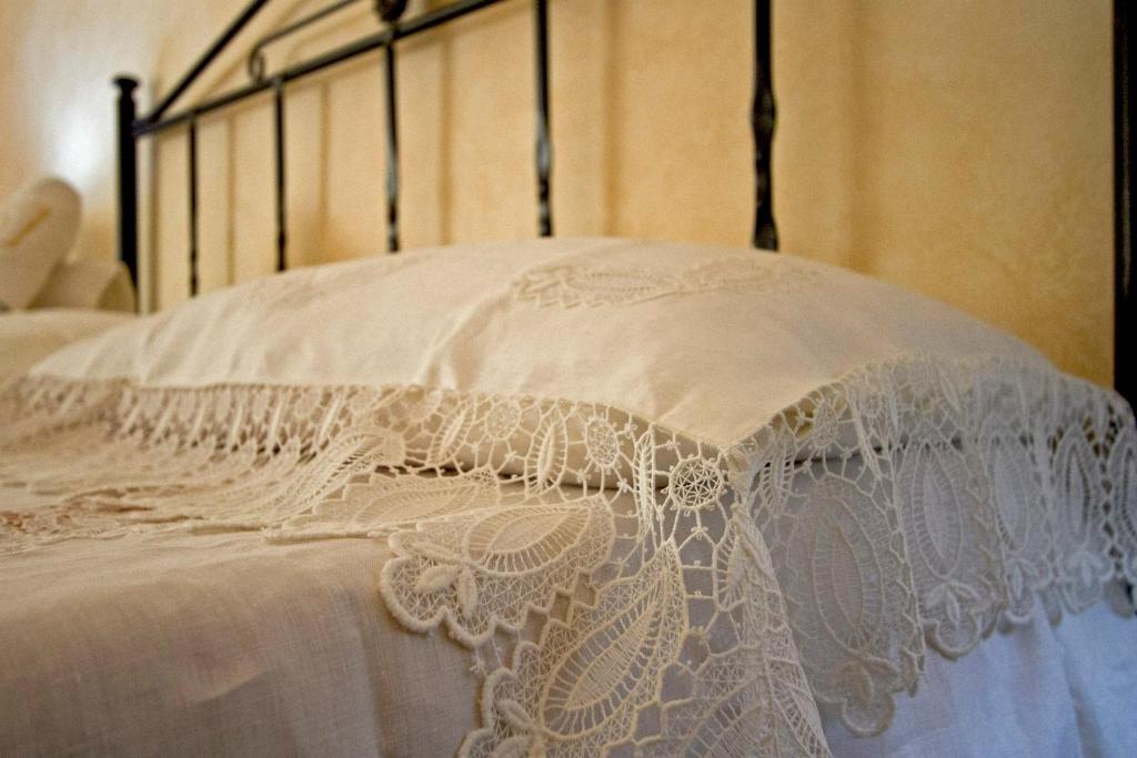 Postel nebo postele na pokoji v ubytování B&B Kalura