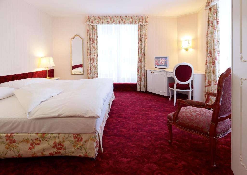 Postel nebo postele na pokoji v ubytování Hotel Mozart