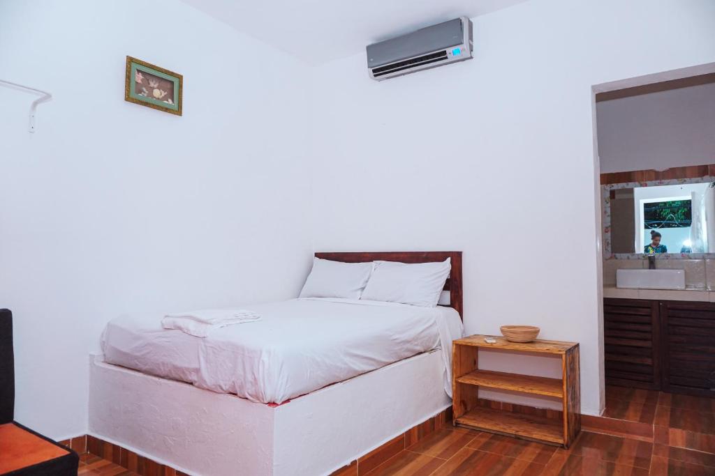 Postel nebo postele na pokoji v ubytování Hotel El Encanto