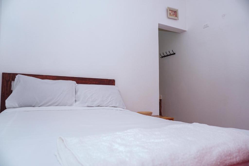 Postel nebo postele na pokoji v ubytování Hotel El Encanto