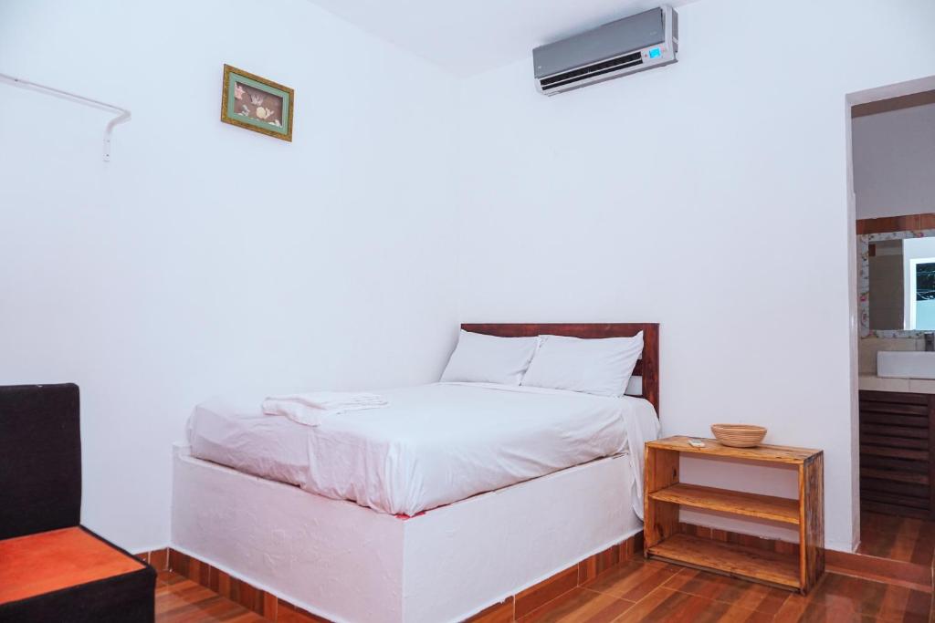 Postel nebo postele na pokoji v ubytování Hotel El Encanto