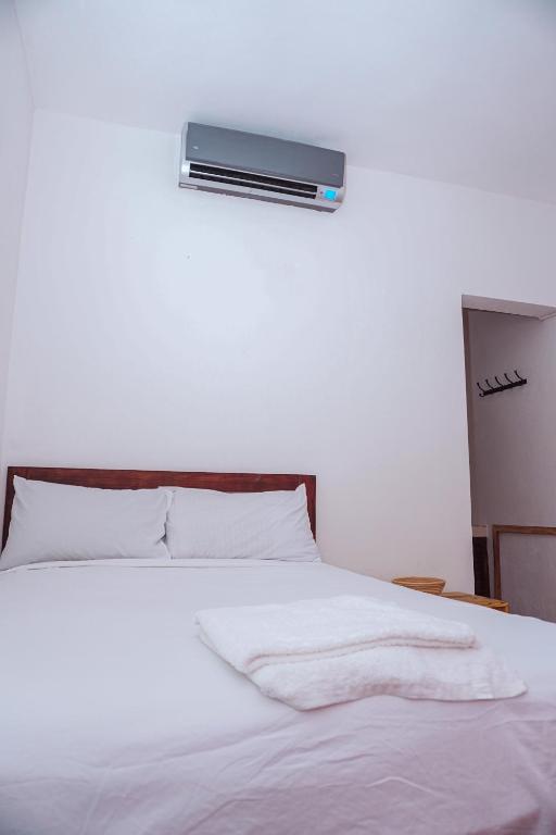 Postel nebo postele na pokoji v ubytování Hotel El Encanto
