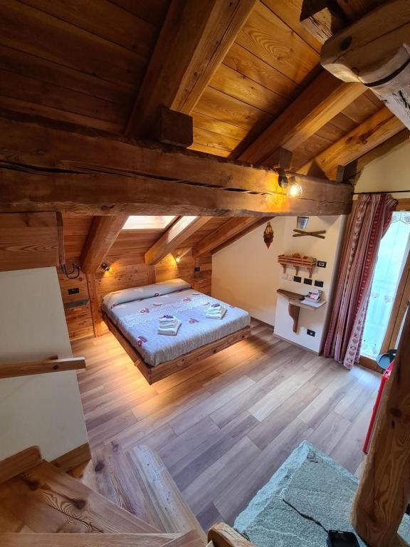 Giường trong phòng chung tại La Maison. Il Nido dell'Aquila