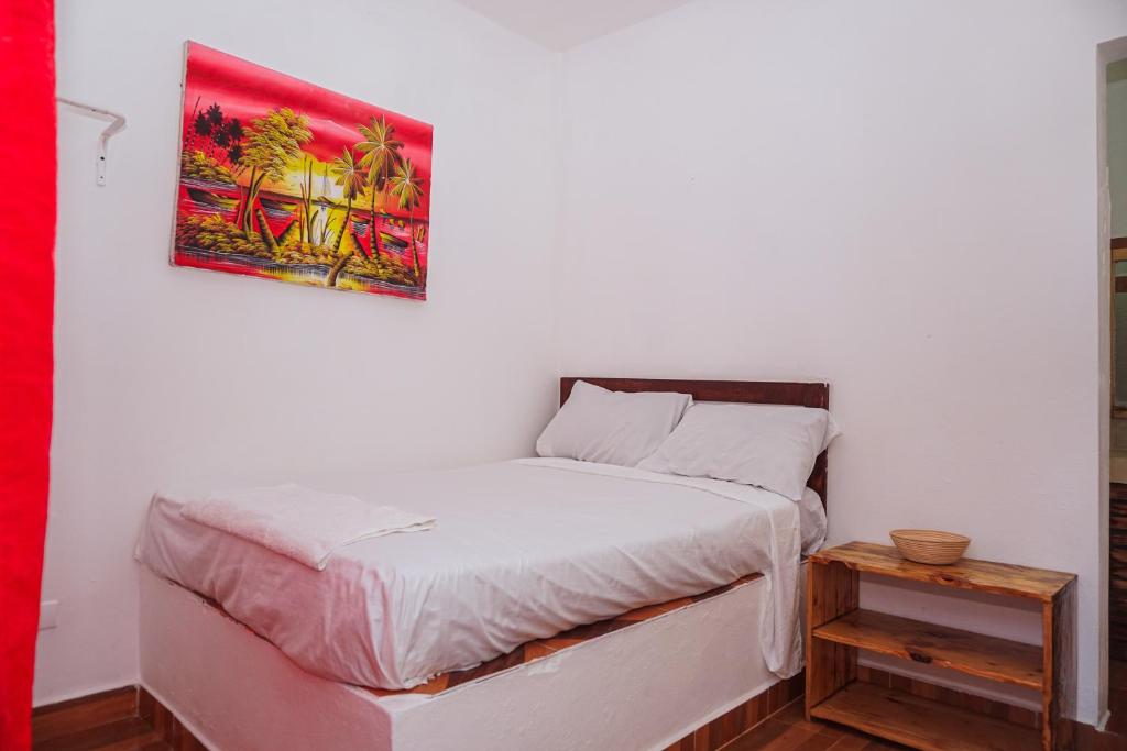 Postel nebo postele na pokoji v ubytování Hotel El Encanto