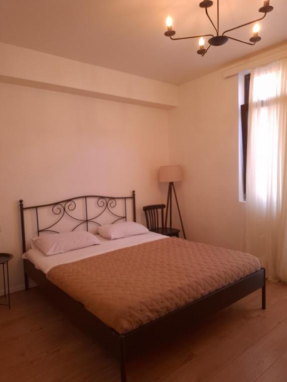 Postel nebo postele na pokoji v ubytování Middle city Guesthouse