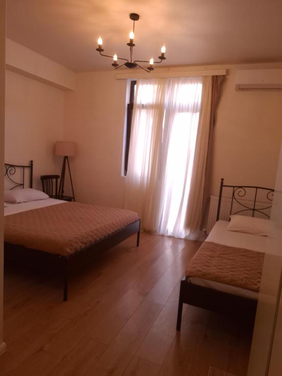 Postel nebo postele na pokoji v ubytování Middle city Guesthouse